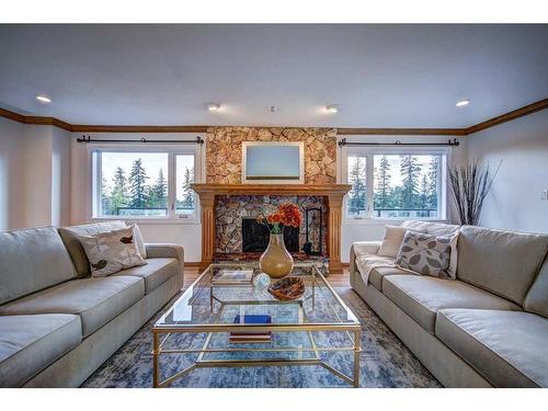 33 Cullen Creek Estates, Rural Rocky View County, AB - Indoor Photo Showing Living Room With Fireplace