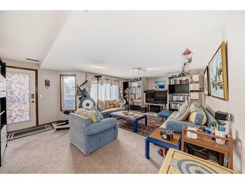 224 Edgebank Circle Nw, Calgary, AB - Indoor Photo Showing Living Room With Fireplace