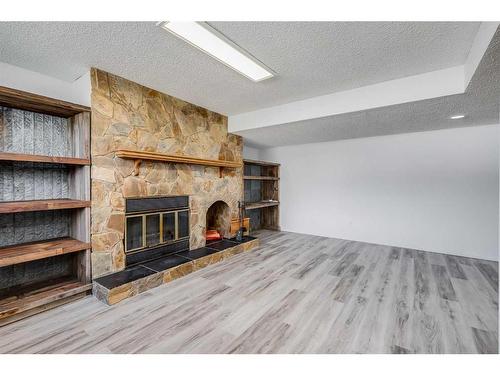 403 Huntington Way Ne, Calgary, AB - Indoor Photo Showing Living Room With Fireplace