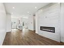 211-595 Mahogany Road Se, Calgary, AB  - Indoor Photo Showing Living Room With Fireplace 