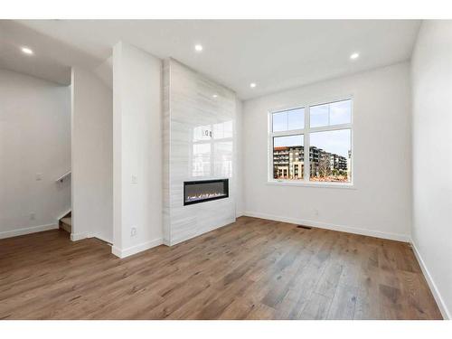 211-595 Mahogany Road Se, Calgary, AB - Indoor With Fireplace