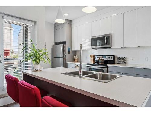 7036 34 Avenue Nw, Calgary, AB - Indoor Photo Showing Kitchen With Stainless Steel Kitchen With Double Sink With Upgraded Kitchen