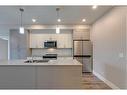 210-1702 17 Avenue Sw, Calgary, AB  - Indoor Photo Showing Kitchen With Double Sink 