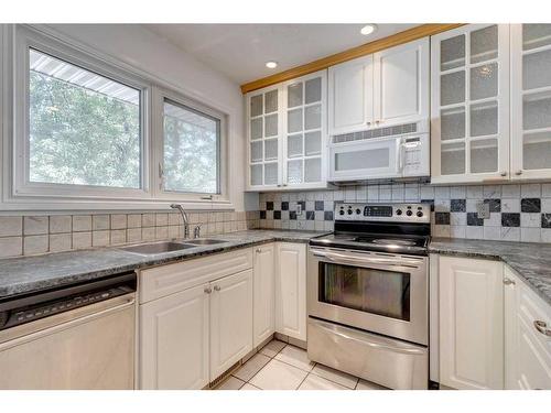 2439 Fir Drive Se, Calgary, AB - Indoor Photo Showing Kitchen With Double Sink