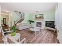 204 Silverado Boulevard Sw, Calgary, AB  - Indoor Photo Showing Living Room With Fireplace 