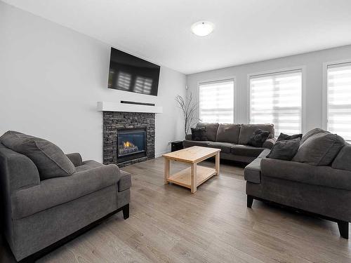 713 Midtown Drive Sw, Airdrie, AB - Indoor Photo Showing Living Room With Fireplace