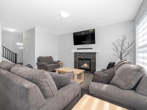 713 Midtown Drive Sw, Airdrie, AB - Indoor Photo Showing Living Room With Fireplace