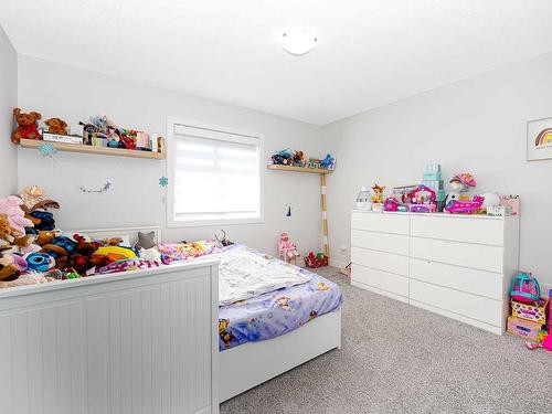 713 Midtown Drive Sw, Airdrie, AB - Indoor Photo Showing Bedroom