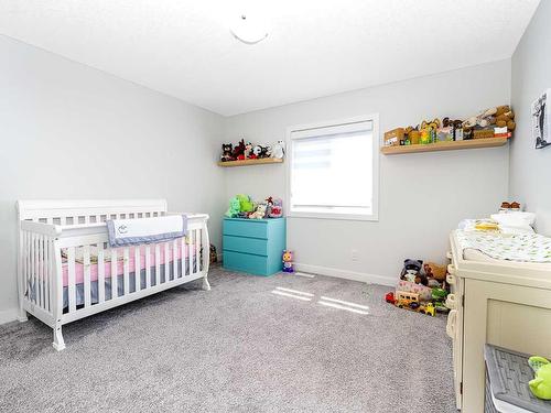 713 Midtown Drive Sw, Airdrie, AB - Indoor Photo Showing Bedroom