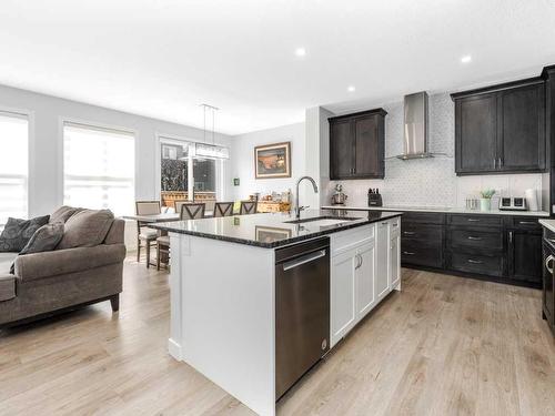 713 Midtown Drive Sw, Airdrie, AB - Indoor Photo Showing Kitchen With Upgraded Kitchen