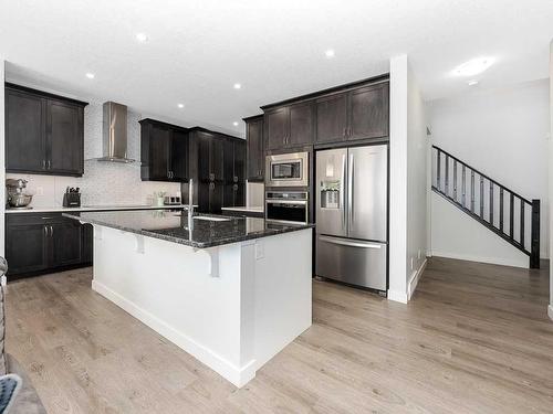 713 Midtown Drive Sw, Airdrie, AB - Indoor Photo Showing Kitchen With Stainless Steel Kitchen With Upgraded Kitchen