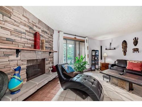 2109-4001B 49 Street Nw, Calgary, AB - Indoor Photo Showing Living Room With Fireplace