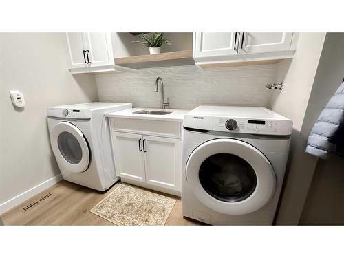 64 Willow Park Green Se, Calgary, AB - Indoor Photo Showing Laundry Room