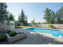 42 Woodhaven Crescent Sw, Calgary, AB  - Outdoor With In Ground Pool With Deck Patio Veranda With Backyard 