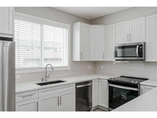 136 Savanna Passage Ne, Calgary, AB - Indoor Photo Showing Kitchen With Double Sink With Upgraded Kitchen