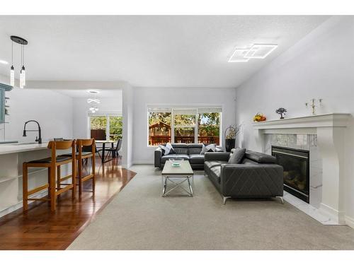 261 Bridleridge View Sw, Calgary, AB - Indoor Photo Showing Living Room With Fireplace