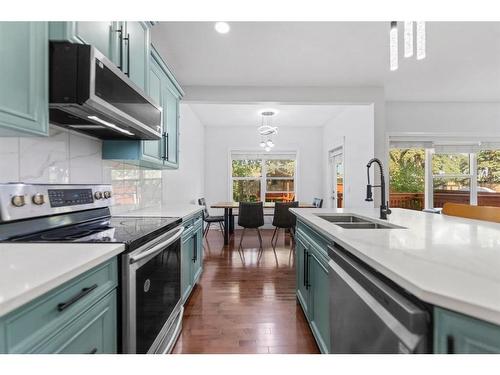 261 Bridleridge View Sw, Calgary, AB - Indoor Photo Showing Kitchen With Double Sink