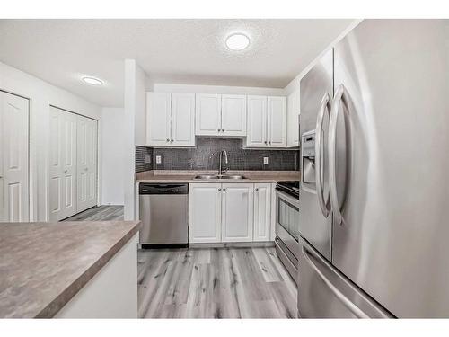 207-3000 Citadel Meadow Point Nw, Calgary, AB - Indoor Photo Showing Kitchen With Stainless Steel Kitchen With Double Sink