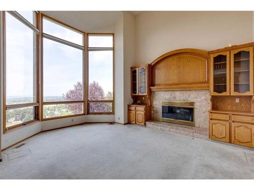 29 Edelweiss Point Nw, Calgary, AB - Indoor With Fireplace