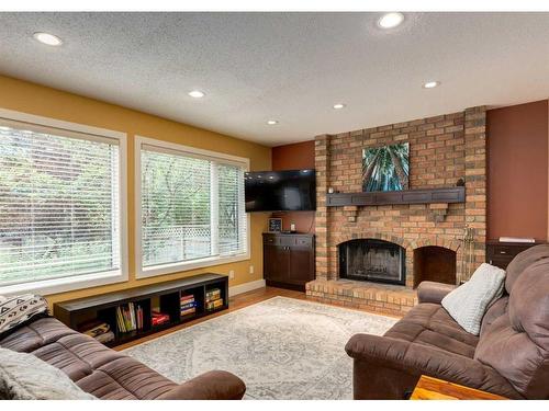 179 Scenic Park Crescent Nw, Calgary, AB - Indoor Photo Showing Living Room With Fireplace