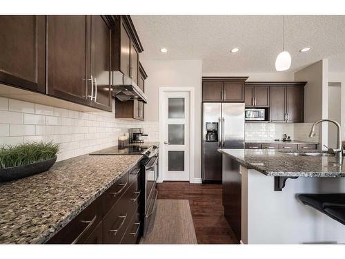 87 Silverado Skies Drive Sw, Calgary, AB - Indoor Photo Showing Kitchen With Double Sink With Upgraded Kitchen