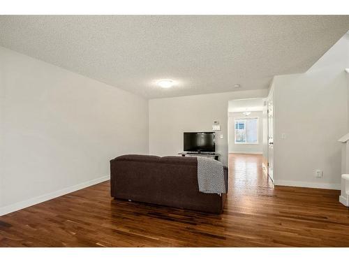 296 Mt Aberdeen Close Se, Calgary, AB - Indoor Photo Showing Living Room