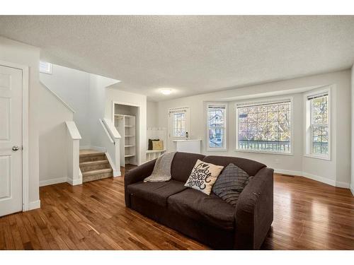 296 Mt Aberdeen Close Se, Calgary, AB - Indoor Photo Showing Living Room