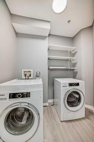 218-3000 Somervale Court Sw, Calgary, AB - Indoor Photo Showing Laundry Room