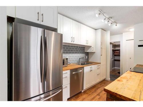 306-835 19 Avenue Sw, Calgary, AB - Indoor Photo Showing Kitchen With Stainless Steel Kitchen With Double Sink