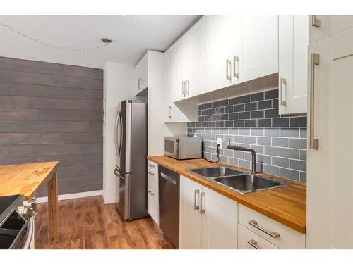 306-835 19 Avenue Sw, Calgary, AB - Indoor Photo Showing Kitchen With Stainless Steel Kitchen With Double Sink