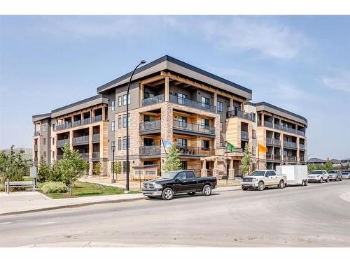 317-125 Wolf Hollow Crescent Se, Calgary, AB - Outdoor With Balcony With Facade