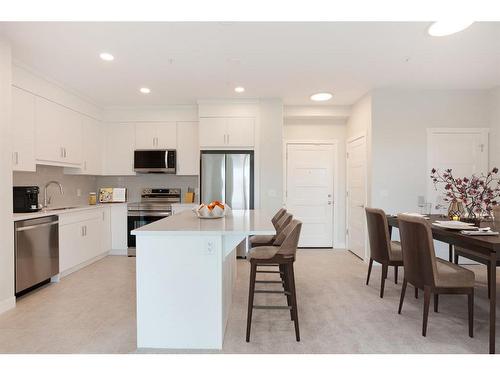 317-125 Wolf Hollow Crescent Se, Calgary, AB - Indoor Photo Showing Kitchen With Stainless Steel Kitchen With Upgraded Kitchen