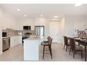 317-125 Wolf Hollow Crescent Se, Calgary, AB  - Indoor Photo Showing Kitchen With Stainless Steel Kitchen With Upgraded Kitchen 