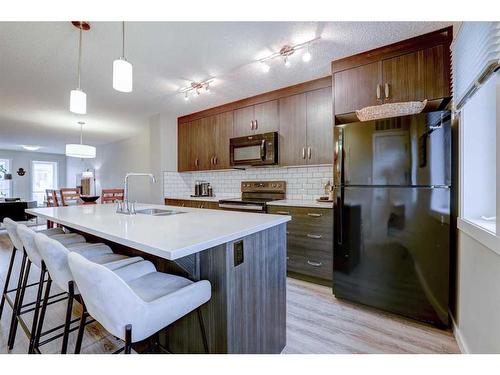 408-50 Westland Road, Okotoks, AB - Indoor Photo Showing Kitchen