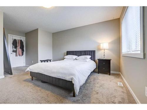 408-50 Westland Road, Okotoks, AB - Indoor Photo Showing Bedroom