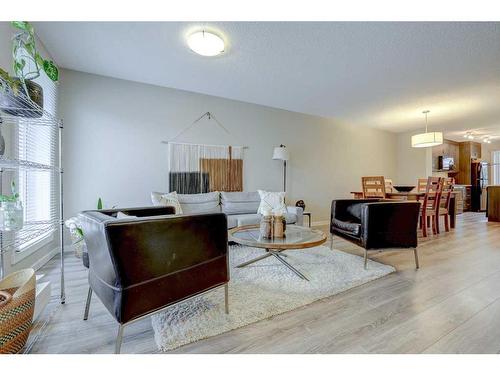 408-50 Westland Road, Okotoks, AB - Indoor Photo Showing Living Room