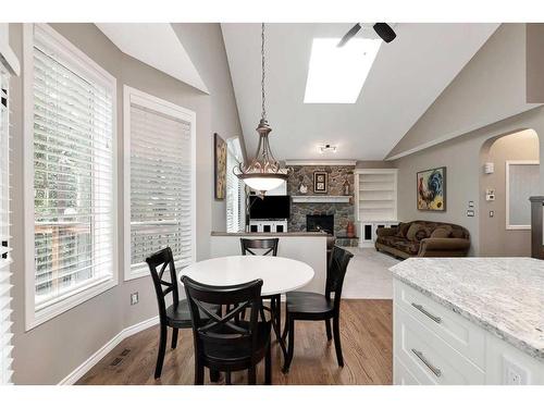 323 Sierra Nevada Place Sw, Calgary, AB - Indoor Photo Showing Dining Room With Fireplace