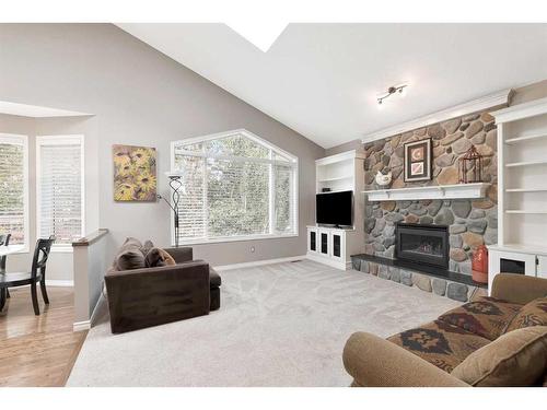 323 Sierra Nevada Place Sw, Calgary, AB - Indoor Photo Showing Living Room With Fireplace