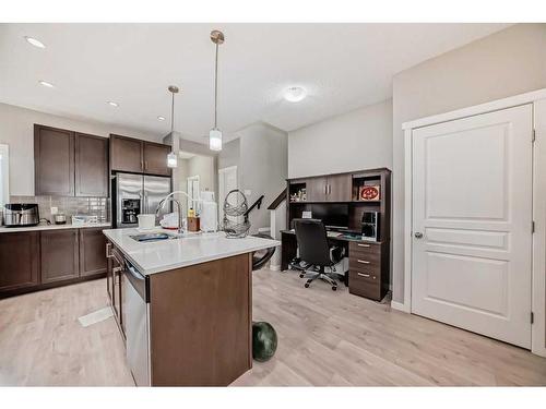 9 Copperpond Avenue Se, Calgary, AB - Indoor Photo Showing Kitchen With Double Sink