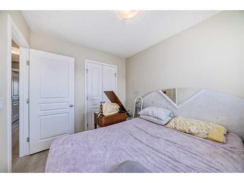 9 Copperpond Avenue Se, Calgary, AB - Indoor Photo Showing Bedroom