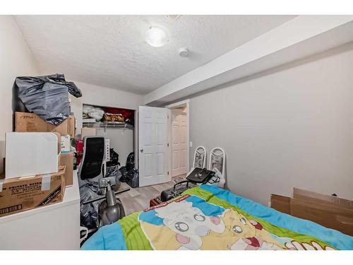 9 Copperpond Avenue Se, Calgary, AB - Indoor Photo Showing Bedroom