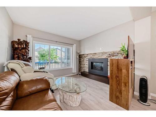 9 Copperpond Avenue Se, Calgary, AB - Indoor Photo Showing Living Room With Fireplace