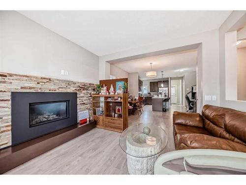 9 Copperpond Avenue Se, Calgary, AB - Indoor Photo Showing Living Room With Fireplace