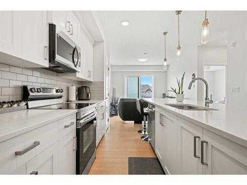 208-40 Carrington Plaza Nw, Calgary, AB - Indoor Photo Showing Kitchen With Upgraded Kitchen