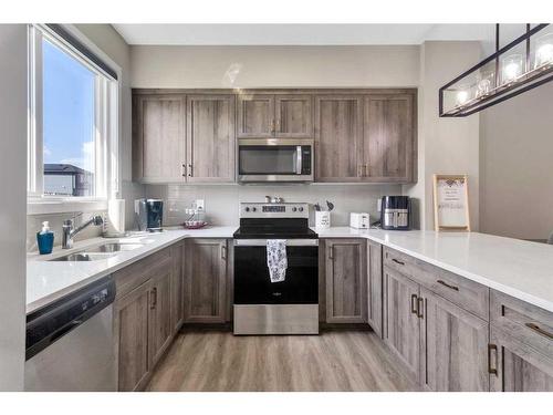 173 Belmont Drive Sw, Calgary, AB - Indoor Photo Showing Kitchen With Stainless Steel Kitchen With Double Sink