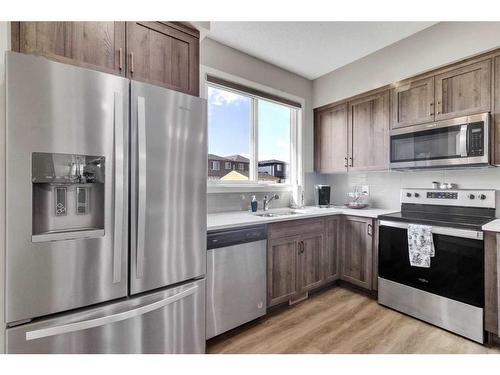 173 Belmont Drive Sw, Calgary, AB - Indoor Photo Showing Kitchen With Stainless Steel Kitchen