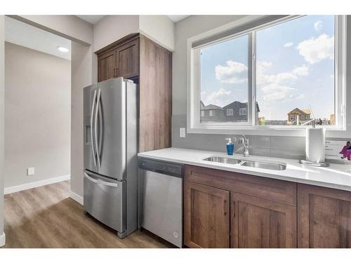 173 Belmont Drive Sw, Calgary, AB - Indoor Photo Showing Kitchen With Double Sink