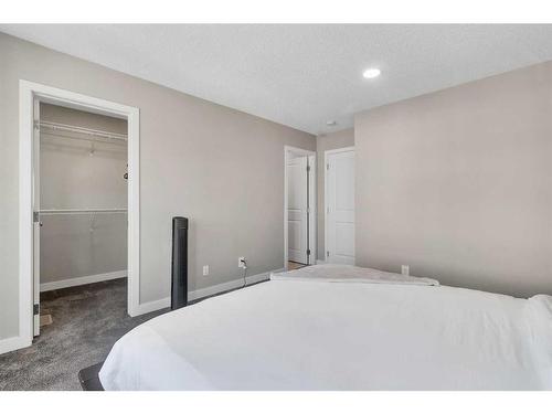 173 Belmont Drive Sw, Calgary, AB - Indoor Photo Showing Bedroom