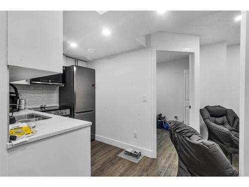 173 Belmont Drive Sw, Calgary, AB - Indoor Photo Showing Kitchen With Double Sink