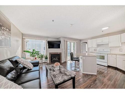 204-3204 Valleyview Park Se, Calgary, AB - Indoor Photo Showing Other Room With Fireplace